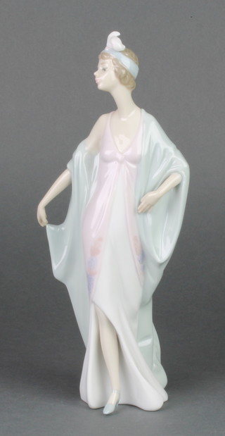 A Lladro figure of a 1920's standing lady 5787 10", boxed