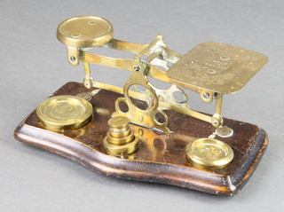 A pair of brass letter scales complete with weights 