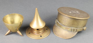A German Pickelhaube helmet spike 3/1", a Trench Art cap ornament  formed from a 1915 18lb shell case and a Trench Art tray
