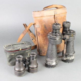 A pair of Naval binoculars contained in a leather carrying case and a pair of opera glasses by Aronsberg & Co. 
