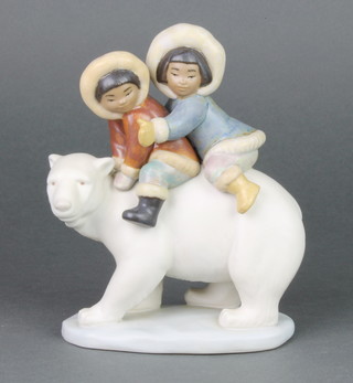 A  Lladro matt figure of 2 children riding a polar bear 2270 7", boxed