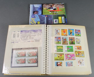 An album of decorative football stamps and a small collection of programmes