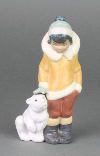 A Lladro matt figure of an Eskimo boy and polar bear cub 2269 6" boxed