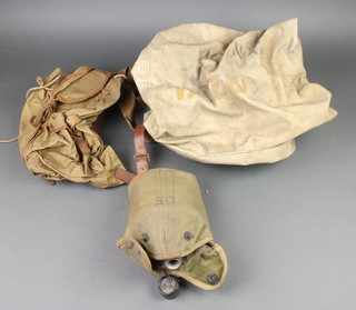 A World War Two Army water bottle complete with fabric case, a small cloth kit bag, a 1930's/40's haversack 