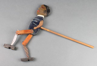 A 1930's wooden dancing figure with articulated limbs 