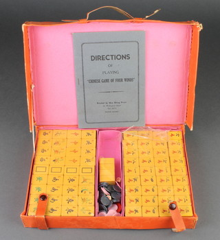 A 1940's composition Mahjong set contained in a fibre case (as new, still wrapped in places)  