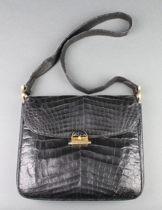 A lady's black crocodile handbag