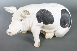 A fibre glass model of a seated Gloucester Old Spot pig 19"h x 39" 