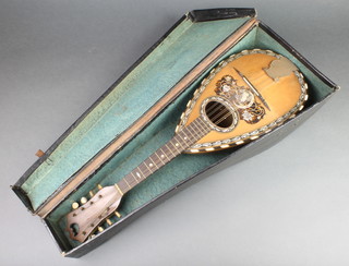A mandolin, the interior labelled F.De Mureda complete with fibre carrying case