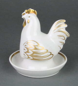 A Royal Worcester gilt decorated egg cup and cover in the form of a seated chicken boxed 