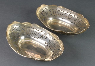 A pair of pierced silver boat shaped bon bon dishes, London 1928, 224 grams 7 1/2" 