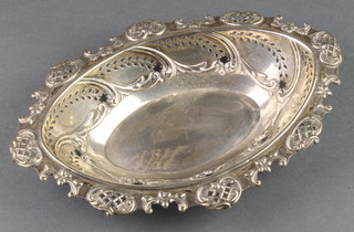 An Edwardian pierced silver oval bon bon dish with scroll decoration, Chester 1902, 172 grams, 9" 