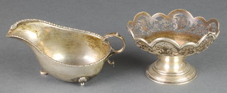 A pierced silver basket Birmingham 1912 and an Edwardian silver sauce boat Birmingham 1902, 188 grams