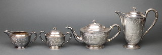 A Chinese silver 4 piece tea set with chased bamboo decorated and ivory resistors by Wai Kee, 1910 grams gross