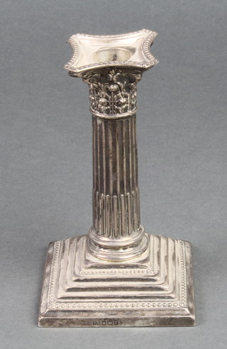 An Edwardian silver Corinthian column dwarf candlestick on a stepped base Sheffield 1805, 5 1/2" 