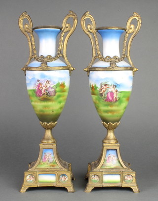 A pair of 19th Century gilt metal mounted urn shaped vases with fete galante scenes 16" 