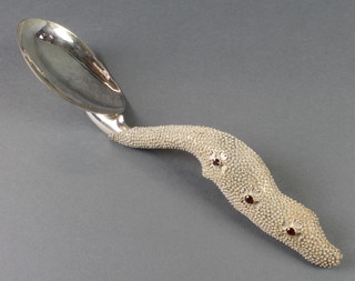 A Continental silver gem set serving spoon with fancy gem set handle in a fitted case, 180 grams