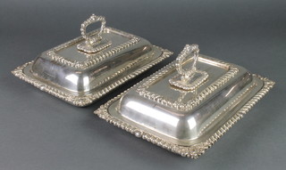A pair of rectangular silver plated entree sets with gadrooned decoration 11" 