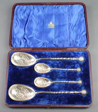 A cased set of 4 Victorian silver plated serving spoons with ball ends, spiral stems and floral chased bowls, contained in a fitted case 
