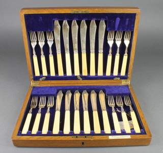 A cased set of 12 fish eaters with silver blades, Sheffield 1923/1924