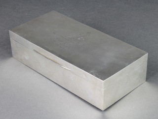 A rectangular silver presentation cigarette box Birmingham 1939 7 1/2" x 3 1/2" 