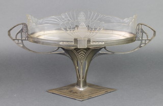 A WMF oval centre piece with twin handles and pierced decoration, the clear cut glass liner with floral sprays 18 1/4"