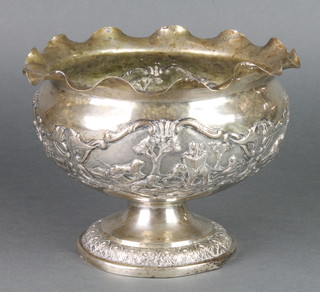 An Indian repousse silver pedestal bowl decorated with hunting scenes and wild animals 9", 596 grams