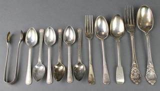 A silver christening spoon and fork, London 1898, minor teaspoons and nips 236 grams