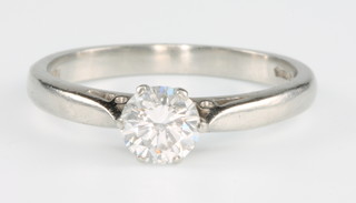 A platinum single stone brilliant cut diamond ring, 0.65ct, size N 1/2