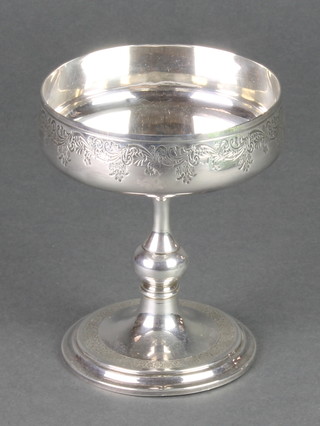 A Continental silver pedestal chalice with chased floral decoration 126 grams 6" 