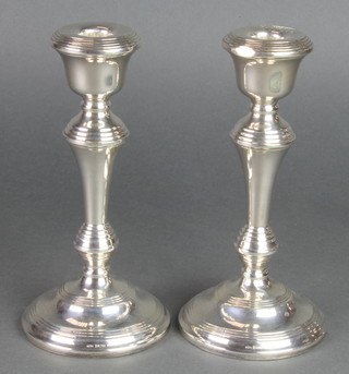 A pair of waisted silver candlesticks of plain form 8" Birmingham 1961 