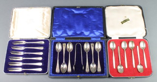 A set of 6 silver coffee spoons Sheffield 1962 cased, a set of 6 chased silver coffee spoons and nips Sheffield 1906 cased and a set of 6 silver cake forks Sheffield 1938 cased, 244 grams