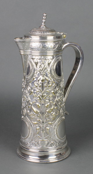A Victorian repousse silver plated claret jug with stylised flowers and vacant cartouches 14" 