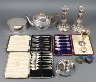 A silver plated Edwardian teapot, a pair of ditto candlesticks and minor plated items 