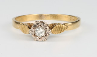 An 18ct yellow gold single stone diamond ring in a fancy mount, size P