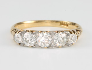 An 18ct yellow gold half hoop diamond ring, size N