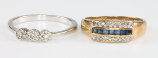 A 9ct yellow gold 3 stone diamond ring size N and a 9ct sapphire and diamond ring dress ring size K