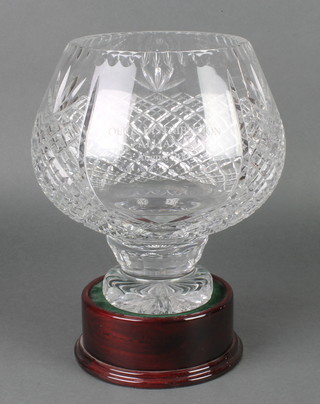 A tulip shaped cut crystal punch bowl with hobnail cut decoration inscribed "OLE Distribution Alliance August 2002" 10" on a turned wood stand