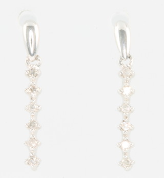 A pair of 9ct white gold diamond set drop earrings