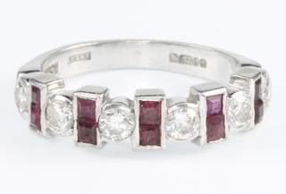 A 14ct white gold ruby and diamond half hoop ring with 6 brilliant cut diamonds and 10 princess cut rubies, size O 