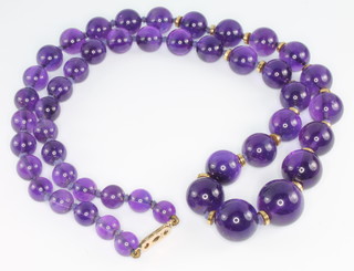 A string of amethyst beads with 9ct yellow gold clasp and gold interspacers 18 1/2" 