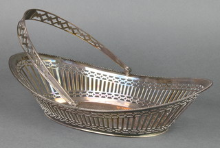 A Victorian silver swing handled basket with pierced decoration, London 1899, 574 grams, 13" 