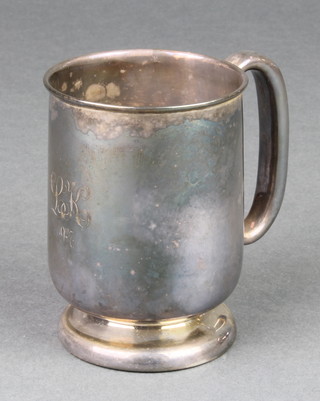A silver christening mug of plain form with chased monogram Birmingham 1927, 124 grams