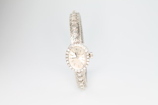 A lady's 18ct white gold and diamond Omega wristwatch on a ditto strap 