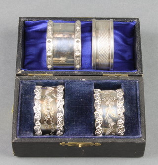 A pair of fancy silver napkin rings Birmingham 1910, 2 others, 90 grams