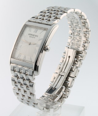A gentleman's steel cased Raymond Weil wristwatch with rectangular dial and steel bracelet, boxed and with paper work and extra link 