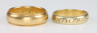 A broad yellow gold wedding band, size S 9.8 grams, a small ditto size N 3.9 grams 