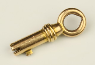 A gold watch key, 6 grams 