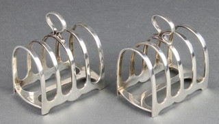 A pair of silver 5 bar toast racks, Sheffield 1934, 664 grams