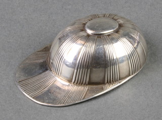 A silver caddy spoon in the form of a jockey's cap, Sheffield 1927, 15 grams